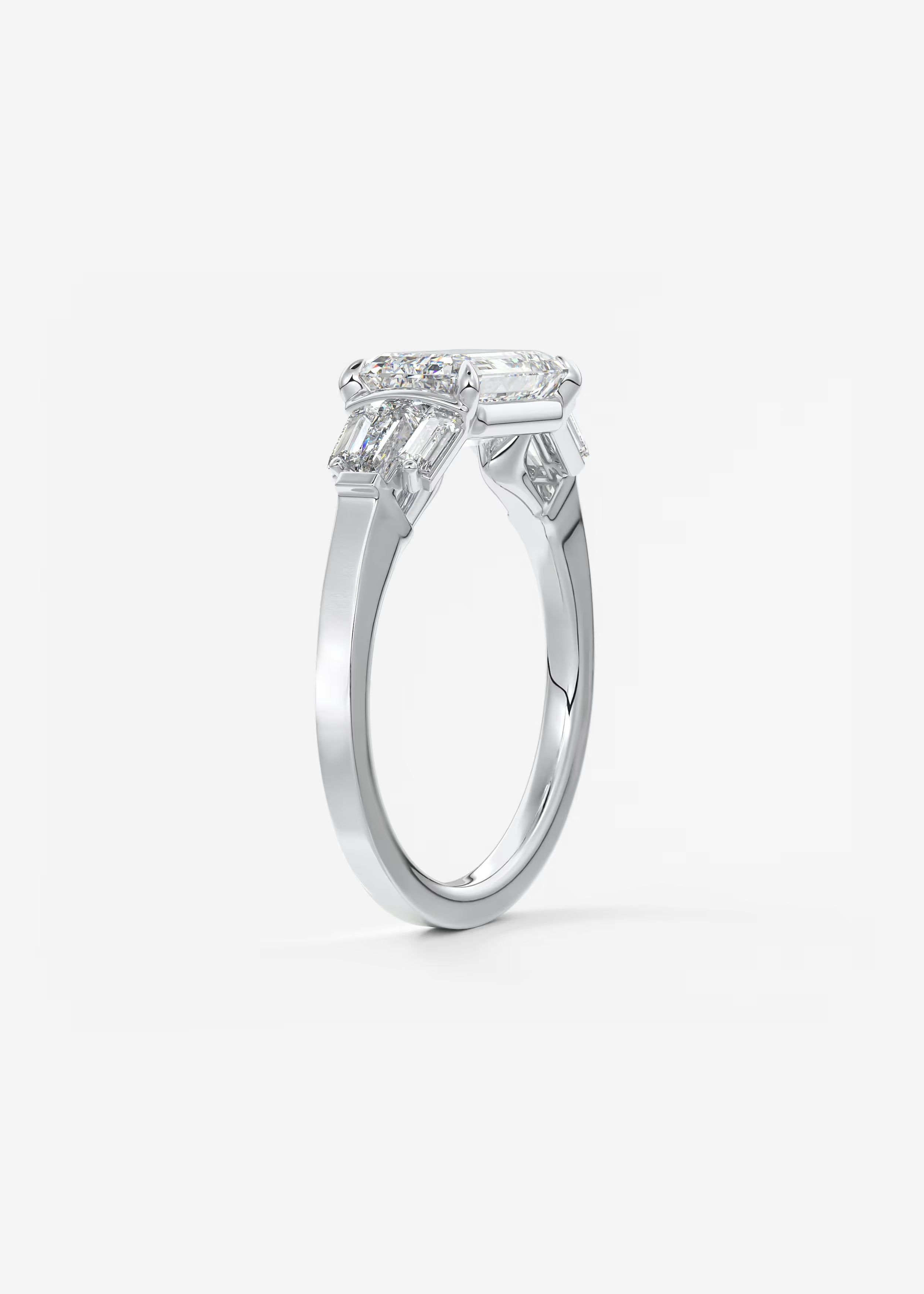 East West Emerald Cut Seven Stone Engagement Ring with Baguette Diamond Accents