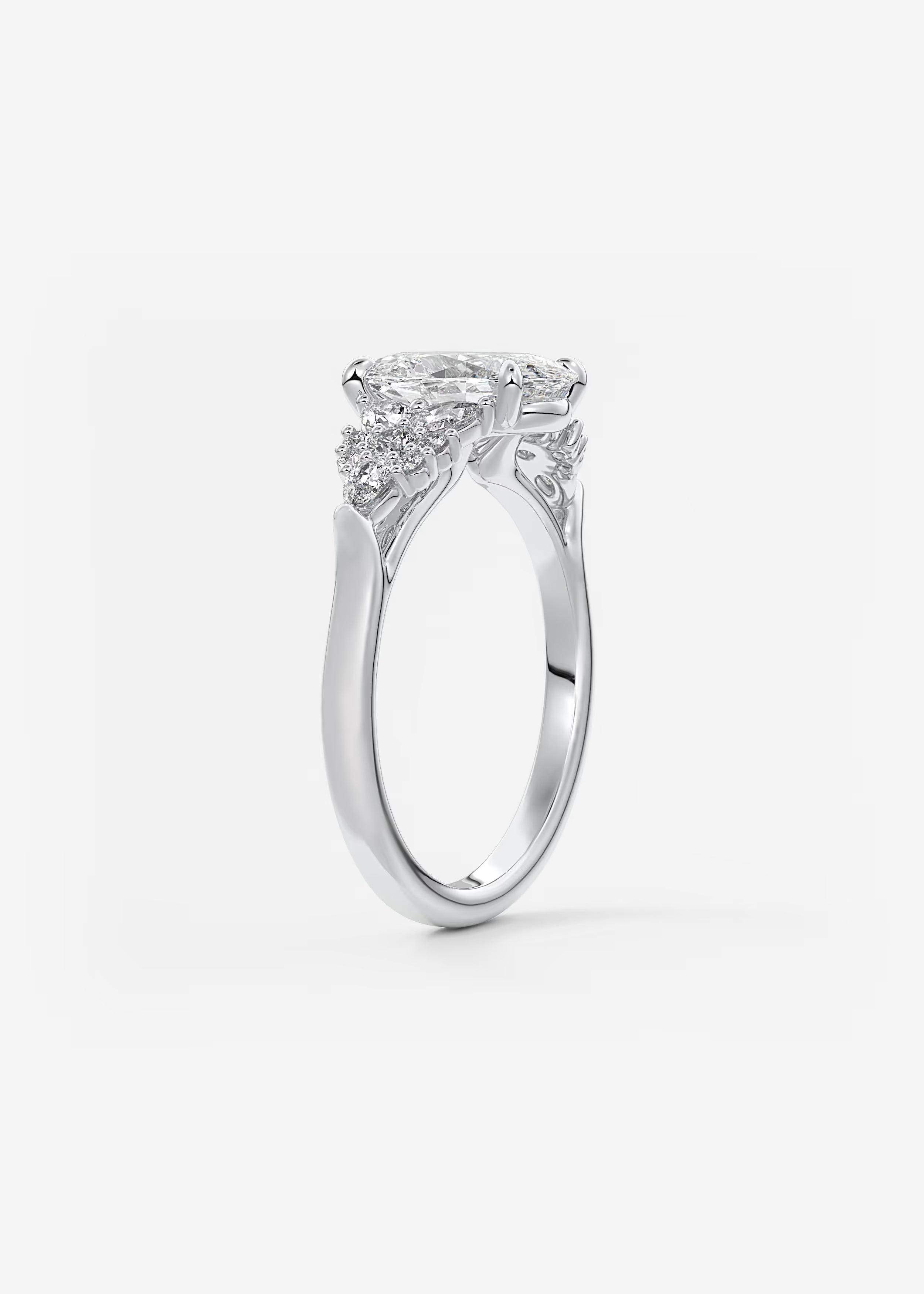 Nature Inspired Oval Engagement Ring with Clustered Diamond Accents